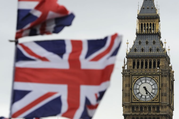 Image: Flags are seen above a souvenir kiosk near Big Ben clock at the Houses of Parliament in central London